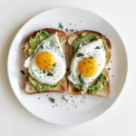 Smashed Avocado on Toast with Sunny-Side- Up Eggs